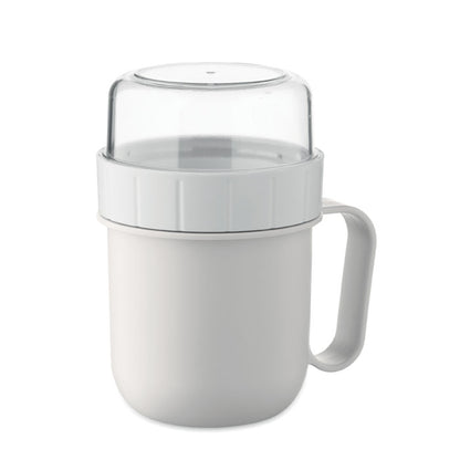 Taza blanca con recipiente para alimentos en tapa
