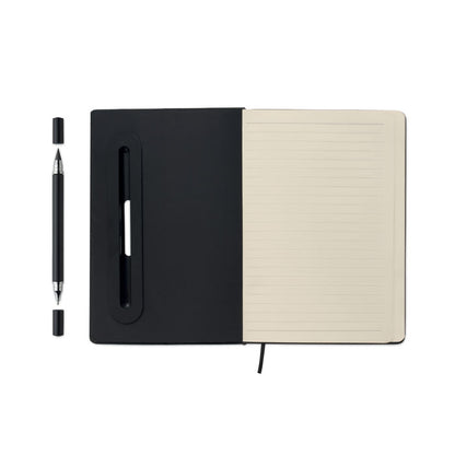 Cuaderno negro abierto con boli al lado