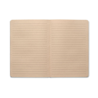 Libreta blanca abierta con hojas rayadas 