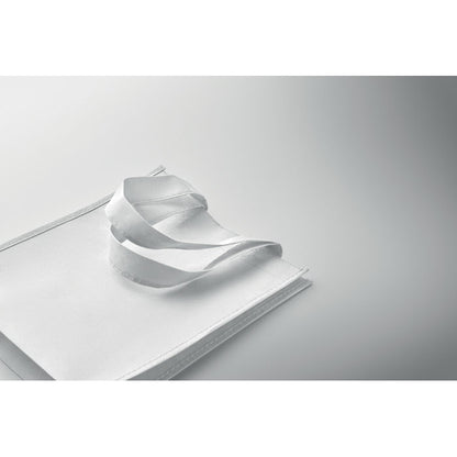 Bolsa tumbada de RPET blanca sobre fondo gris