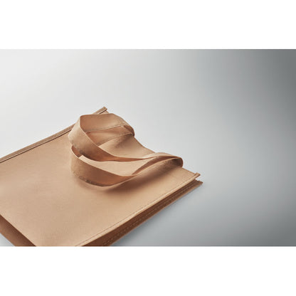 Bolsa tumbada de RPET marrón sobre fondo gris