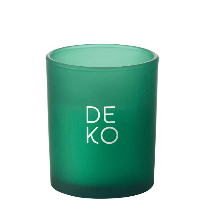 Vela en frasco de vidrio verde mate con texto blanco, diseñado para un toque elegante en la decoración de interiores.