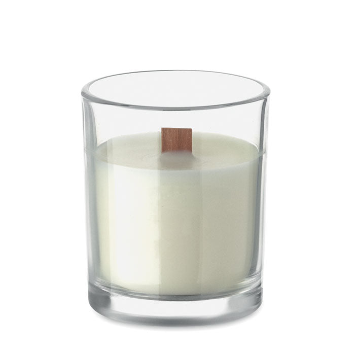 Vista frontal de vela de cera vegetal de 80 gr con fragancia de vainilla en recipiente de vidrio y mecha de madera.