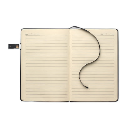 Libreta abierta mostrando hojas color crema rayadas con marcapáginas