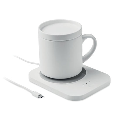Taza sobre calentador de tazas y cargador inalámbrico blanco