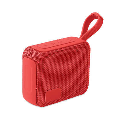 Vista lateral de altavoz rojo inalámbrico con asa