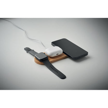 Base de carga con reloj, móvil y auriculares cargando