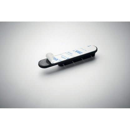 Organizador de cables negro con ranuras para varios cables