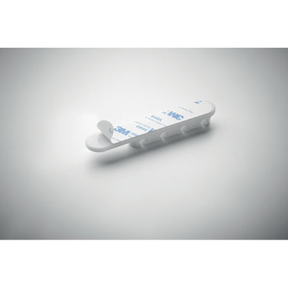 Vista frontal del organizador de cables con diseño ovalado