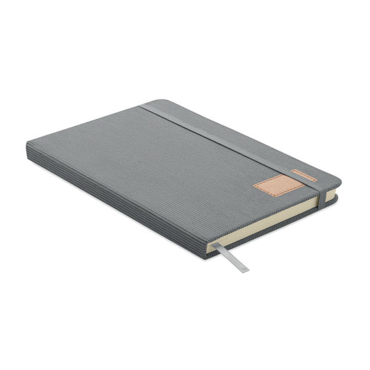 Vista de perfil de libreta gris en tejido de pana con goma elástica: CORDI NOTE - Libreta pana A5 tapa dura RPET.