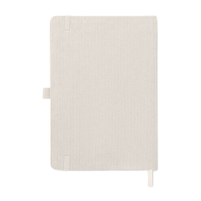 Interior de libreta beige con papel rayado