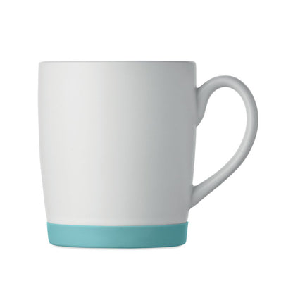 Taza blanca mate con base turquesa vista lateral sin asa