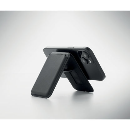 Tarjetero magnético negro colocado en la parte trasera del móvil