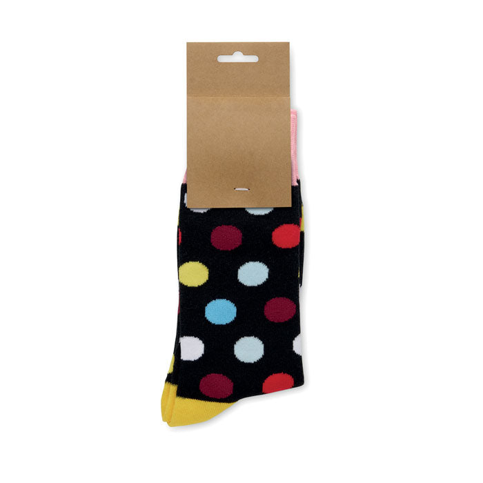 FUNNY M - Calcetines estampados alegres con diseño de lunares multicolores sobre fondo negro.