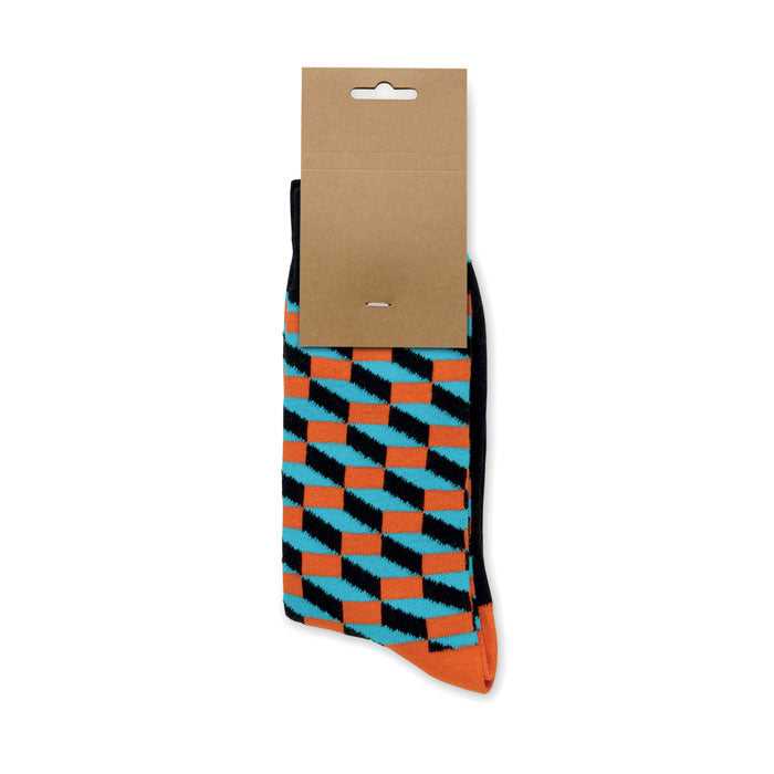 FUNNY M - Calcetines estampados alegres con diseño divertido en colores naranja y azul en embalaje de papel kraft.