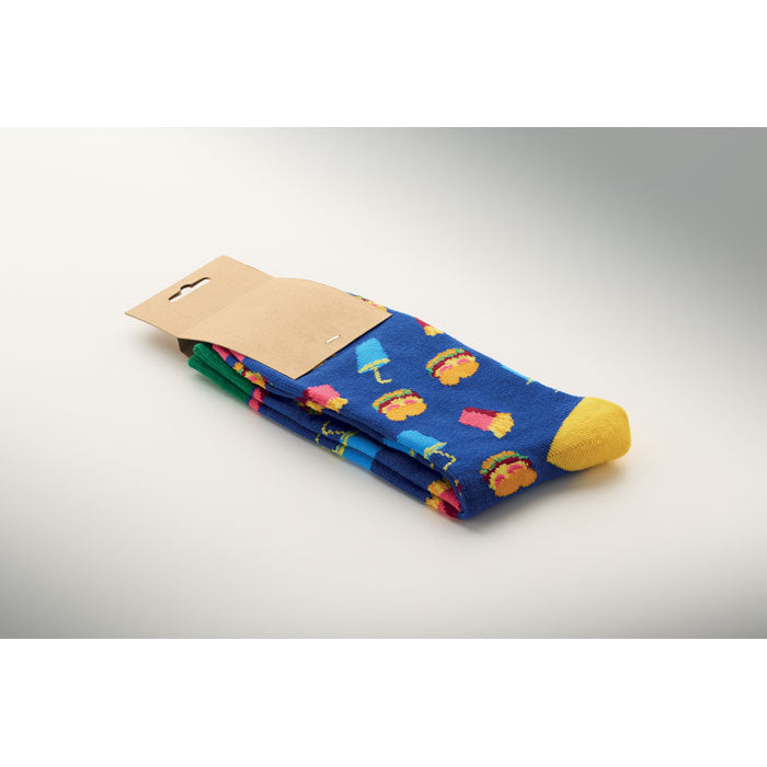 Calcetines estampados alegres FUNNY M en colores vibrantes con diseño divertido, presentados en empaque de papel kraft.
