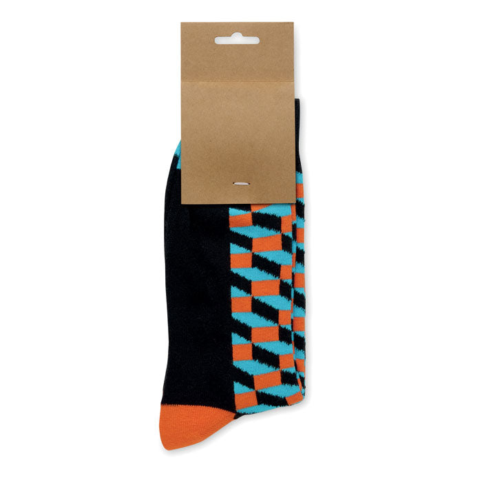 FUNNY L - Calcetines estampados alegres en fondo negro con diseño colorido y etiqueta de papel kraft.