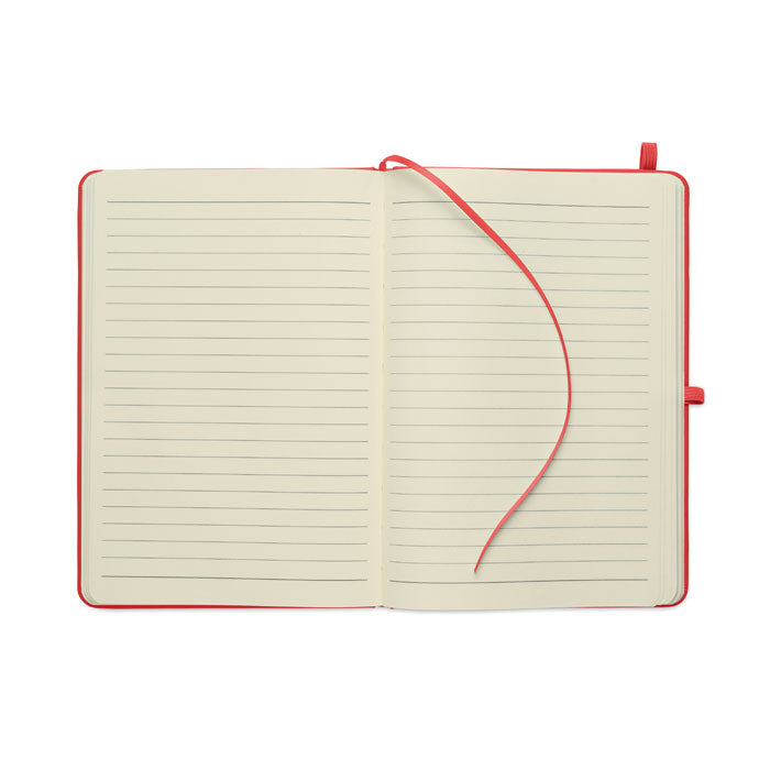 ARCOLOOP - Libreta A5 de PU reciclado abierta con páginas rayadas y cinta marcapáginas rojo.