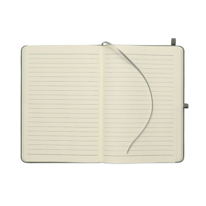 ARCOLOOP - Libreta A5 de PU reciclado abierta mostrando páginas rayadas y cinta marcapáginas.