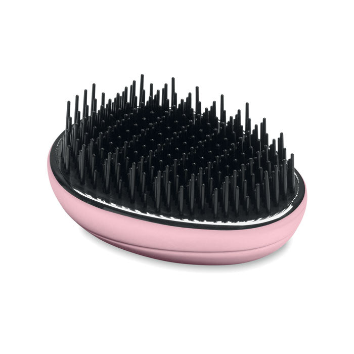 Cepillo antienredos para cabello en color rosa con cerdas negras, diseñado para desenredar suavemente el cabello.