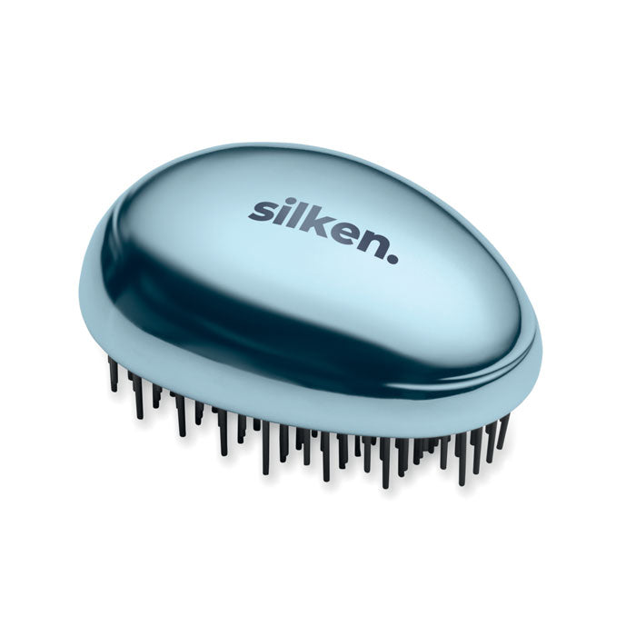 Cepillo antienredos para cabello de color azul con diseño ergonómico y logo de silken.