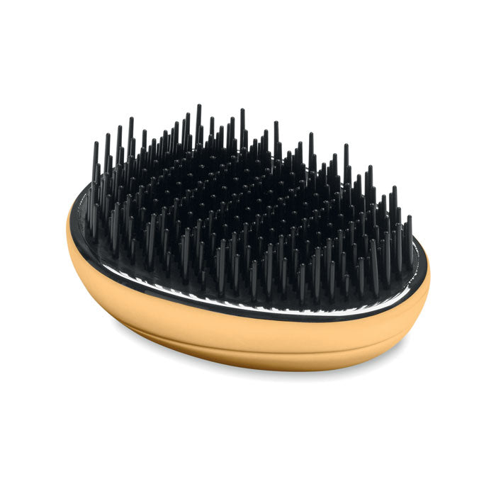 Cepillo antienredos para cabello con diseño ergonómico y cerdas suaves para desenredar sin dolor.