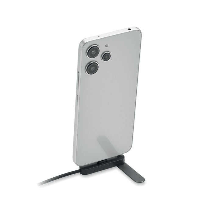 NIFTY - Cable USB-C 60W con soporte utilizado con un teléfono móvil en un soporte de carga.