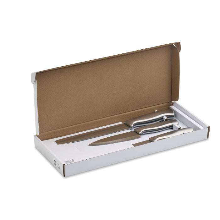 COCINERO - Juego de cuchillos  3 piezas en caja abierta mostrando cuchillos de acero inoxidable.