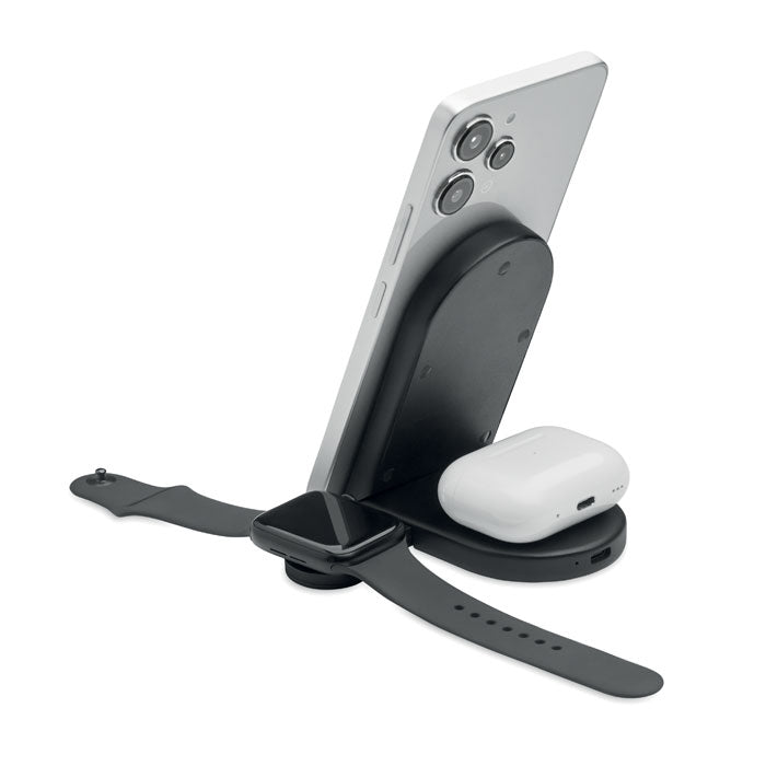 ELASTI - Cargador plegable de 15 W mostrando un teléfono, reloj y auriculares en el soporte de carga inalámbrico.