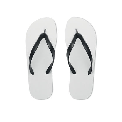 Vista superior de chanclas blancas con tiras negras