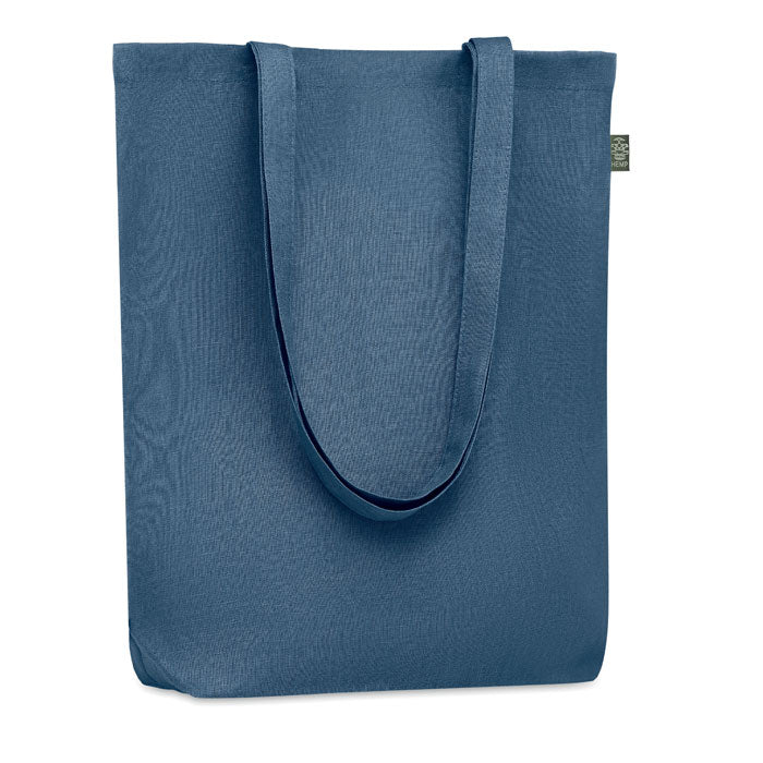 Bolsa de compra de cáñamo azul con asas largas y un acabado suave, ideal para uso diario.
