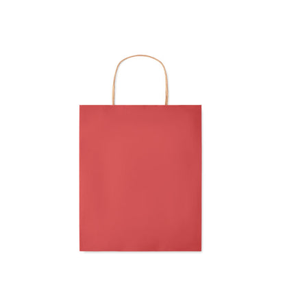 Vista frontal de bolsa roja de papel con asas retorcidas