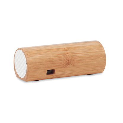 Vista trasera de altavoz cilíndrico de madera con clavija para cable