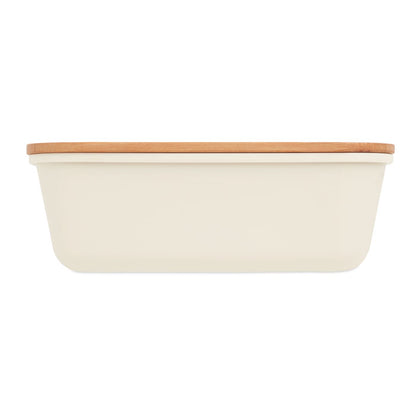 Vista lateral de fiambrera blanca con tapa de madera