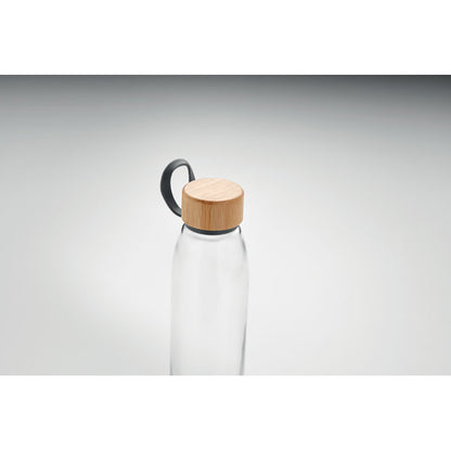 parte superior de botella de cristal con tapa de bambú