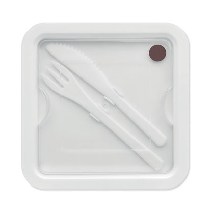 Vista superior de tapa de fiambrera blanca con cubiertos