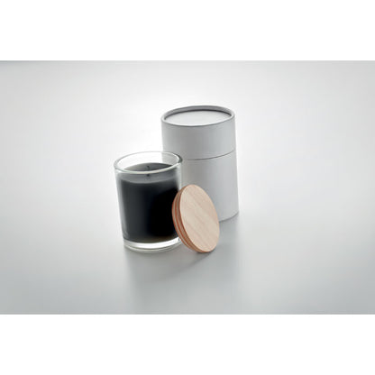 Vela de cristal negra con tapa de madera en fondo gris