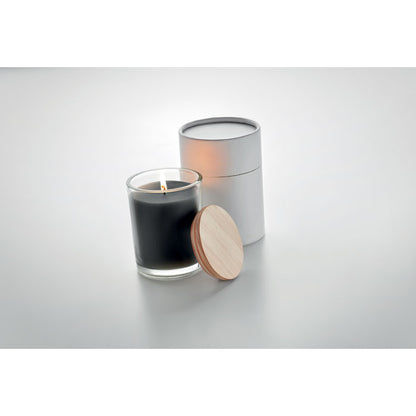 Vela de cristal negra con tapa de madera en fondo gris