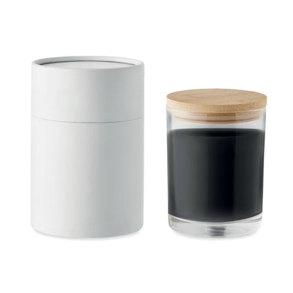 Vela de vidrio negra, tapa de bambú caja cilíndrica al lado