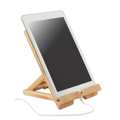 Tablet sobre soporte de madera con abertura para cable