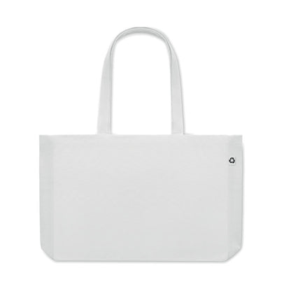 Bolsa de algodón blanca con asas largas y fuelle y con etiqueta de algodón orgánico cosida en un lateral