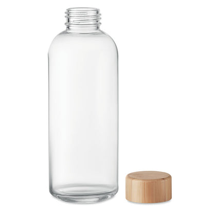 Botella de cristal transparente y tapón de madera