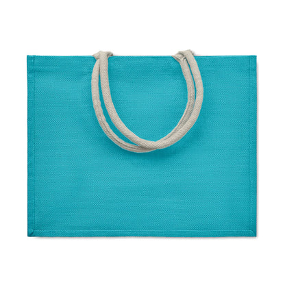 Bolsa de compra de yute turquesa con asas blancas