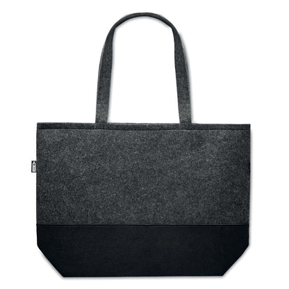 Bolsa de playa de fieltro gris con base de color negro y con etiqueta negra con símbolo de RPET
