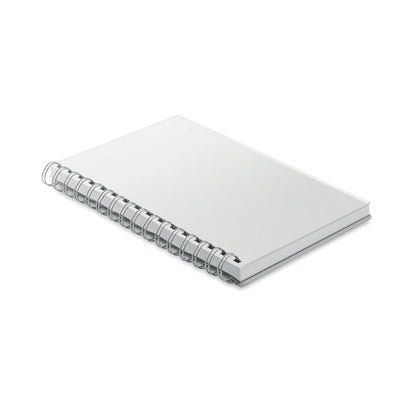 Vista lateral libreta blanca encuadernada con espiral