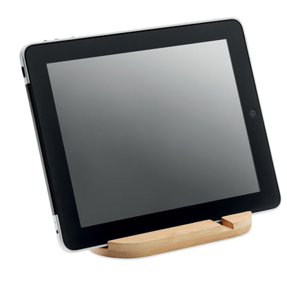 Tablet puesta en horizontal sobre soporte de madera de bambú