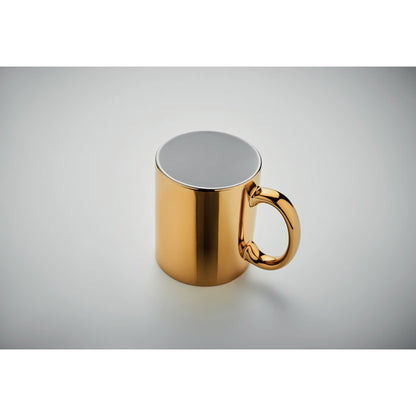 Mug de cerámica blanca con revestimiento exterior dorado metálico