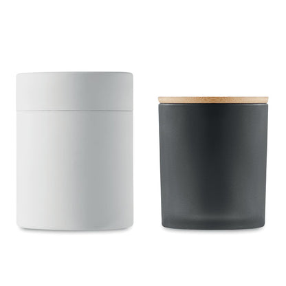 Caja cilíndrica blanca con vela negra