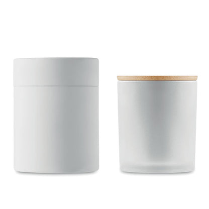 Caja cilíndrica blanca con vela blanca
