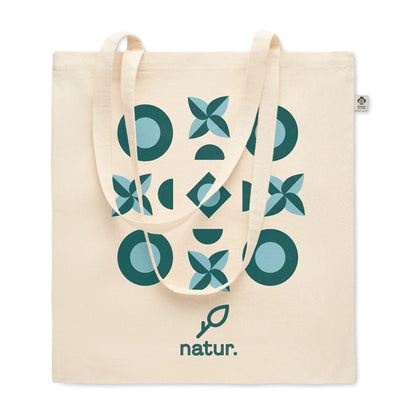 Tote de algdoón color natural personalizada con un diseño grande de varios colores y un logotipo